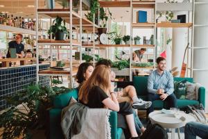 a group of people sitting in a room at Zoku Copenhagen in Copenhagen