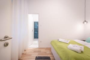 Posteľ alebo postele v izbe v ubytovaní Delta Curve Apartment