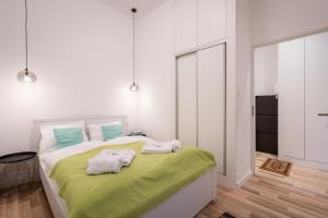 Posteľ alebo postele v izbe v ubytovaní Delta Curve Apartment