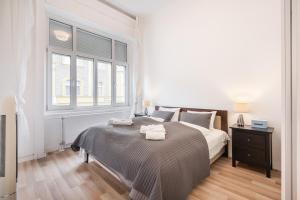 Posteľ alebo postele v izbe v ubytovaní Delta Curve Apartment