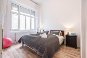Posteľ alebo postele v izbe v ubytovaní Delta Curve Apartment