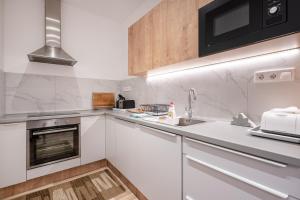 Kuchyňa alebo kuchynka v ubytovaní Delta Curve Apartment