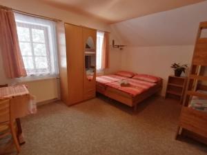 Posteľ alebo postele v izbe v ubytovaní Apartmány 670 pod Lysou horou