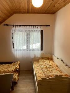 Postel nebo postele na pokoji v ubytování Vila Lane