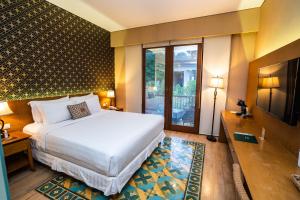 Abhayagiri - Sumberwatu Heritage Resort tesisinde bir odada yatak veya yataklar