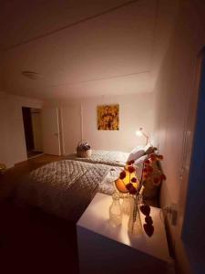 a bedroom with a bed with a lamp on it at Fantastisch familiehuis met sauna aan het water in Föllinge