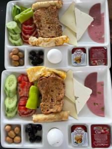 a lunch box filled with different types of food at NOVA PORT Boutique Hotel in Tekirdag