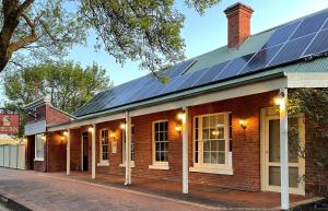 a brick building with solar panels on the roof at 187 Heathcote in Heathcote