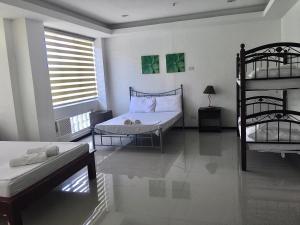 Krevet ili kreveti u jedinici u okviru objekta OYO 921 Sorrento Hotel And Resort