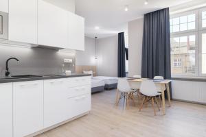 Kuchyňa alebo kuchynka v ubytovaní Apart Avenue 22