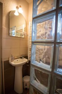a bathroom with a sink and a mirror at Casa Tibi in Praid +14 photos