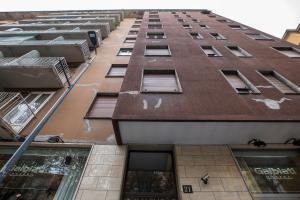 a tall building with windows on the side of it at GoodVibesHome in Milan