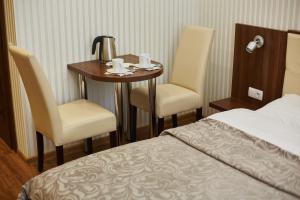 Postel nebo postele na pokoji v ubytování Three Crowns Hotel