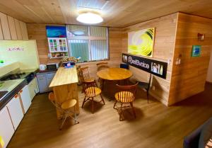 a kitchen with a table and chairs in a room at Peakuki'i Bear's Guest House - Vacation STAY 76557v in Namihira