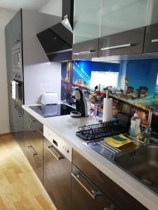 a kitchen with a sink and a counter top at Apartment Tesla in Vienna