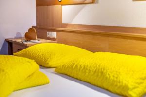 A bed or beds in a room at Niederkoflhof Wollbach