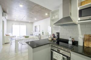 a kitchen with a counter top and a dining room at Mama mía! a estrenar con pileta. in Asuncion