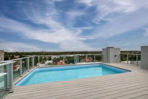 a swimming pool on the deck of a house at Mama mía! a estrenar con pileta. in Asuncion