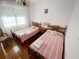 En eller flere senge i et værelse på La Casa de Lalo