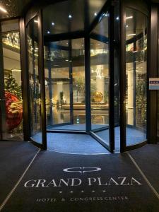 a front door of a building with the words grand plaza at Grand Plaza Hotel & Congress Center in Ljubljana