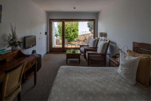 Телевизор и/или развлекательный центр в Boutique Hotel El Tio Kiko