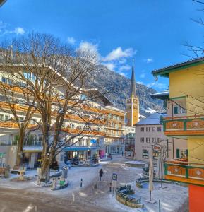 a view of a town with a church at Hotel Austria in Bad Hofgastein