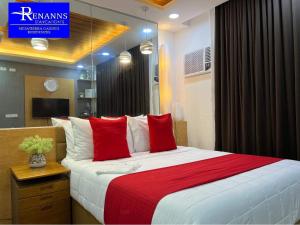 Postel nebo postele na pokoji v ubytování Rinann's Staycation 1021 Mesatierra Condotel Davao + 8 fotografií