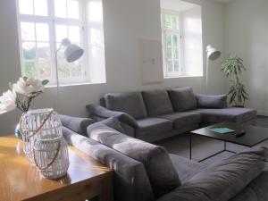 a living room with a couch and a table at Azores Youth Hostels - Sao Miguel in Ponta Delgada