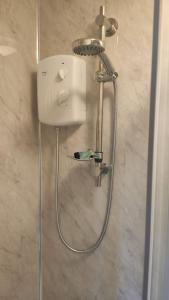 a shower in a bathroom with a shower at 1 Bedroom Studio in a Supurb Area of Cardiff in Cardiff