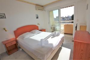 Posteľ alebo postele v izbe v ubytovaní Appartement 80 m2 au centre-ville de Cannes