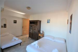 Posteľ alebo postele v izbe v ubytovaní Appartement 80 m2 au centre-ville de Cannes