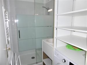 a bathroom with a shower and a sink and a toilet at Appartment Erwan in Arzon