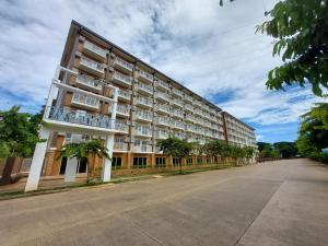 a large apartment building on the side of a street at CONDO unit in Puerto Princesa Palawan in Puerto Princesa City