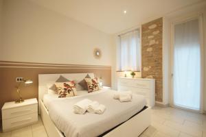 Uma cama ou camas num quarto em Truly Verona