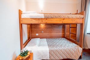 Postel nebo postele na pokoji v ubytování Garnì Vecchio Comune