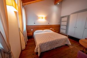 Postel nebo postele na pokoji v ubytování Garnì Vecchio Comune