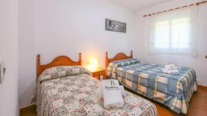 A bed or beds in a room at Casa rural el Tejar Higuera de la Sierra by Ruralidays