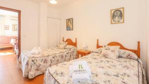 A bed or beds in a room at Casa rural el Tejar Higuera de la Sierra by Ruralidays