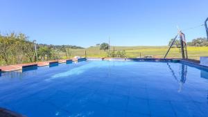 The swimming pool at or close to Casa rural el Tejar Higuera de la Sierra by Ruralidays