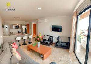 a living room with a couch and a table at Suites calle 38 in Playa del Carmen