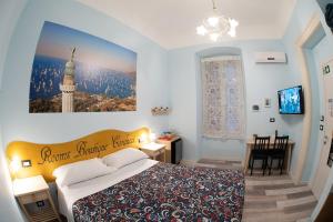 Postel nebo postele na pokoji v ubytování Rooms Boutique Carducci