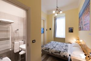 Postel nebo postele na pokoji v ubytování Rooms Boutique Carducci