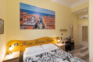 Postel nebo postele na pokoji v ubytování Rooms Boutique Carducci