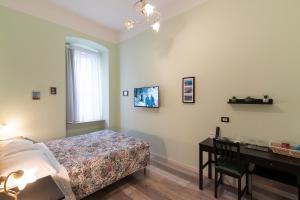 Postel nebo postele na pokoji v ubytování Rooms Boutique Carducci