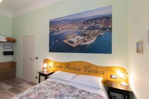 Postel nebo postele na pokoji v ubytování Rooms Boutique Carducci