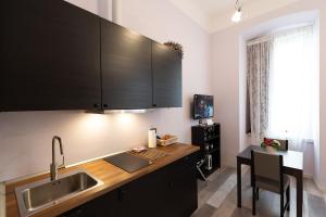 Kuchyň nebo kuchyňský kout v ubytování Rooms Boutique Carducci