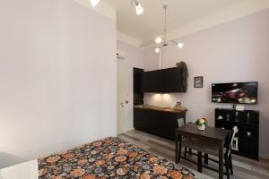 Kuchyň nebo kuchyňský kout v ubytování Rooms Boutique Carducci