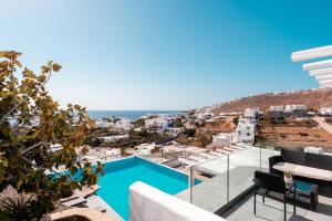a view from the balcony of a villa with a swimming pool at Mr & Mrs White Mykonos in Platis Gialos