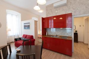 Kuchyň nebo kuchyňský kout v ubytování Rooms Boutique Carducci
