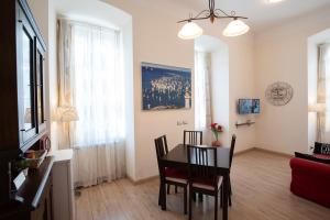 TV a/nebo společenská místnost v ubytování Rooms Boutique Carducci